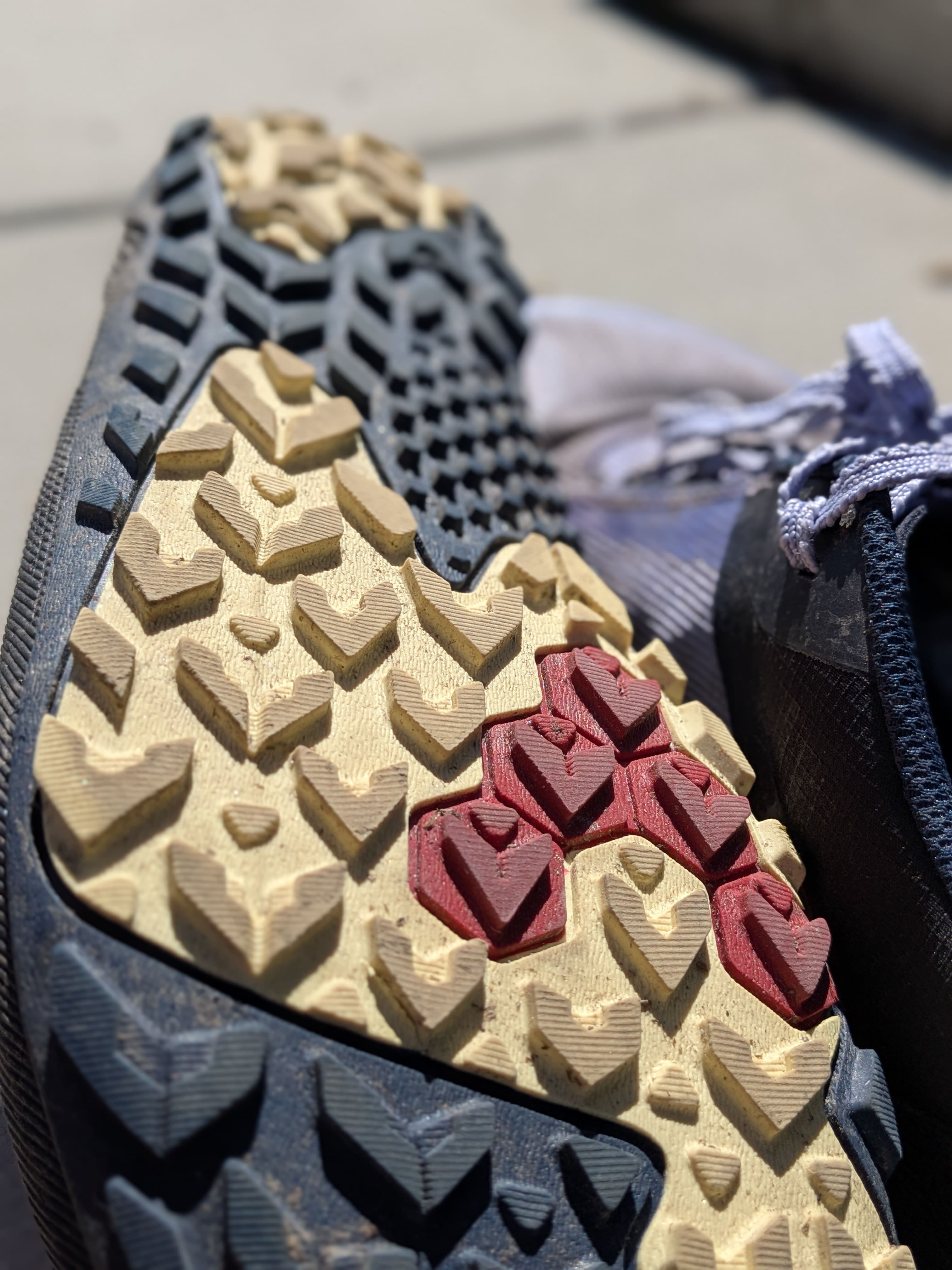 Vivobarefoot Primus Trail Flow outsole showing improved chevron tread pattern